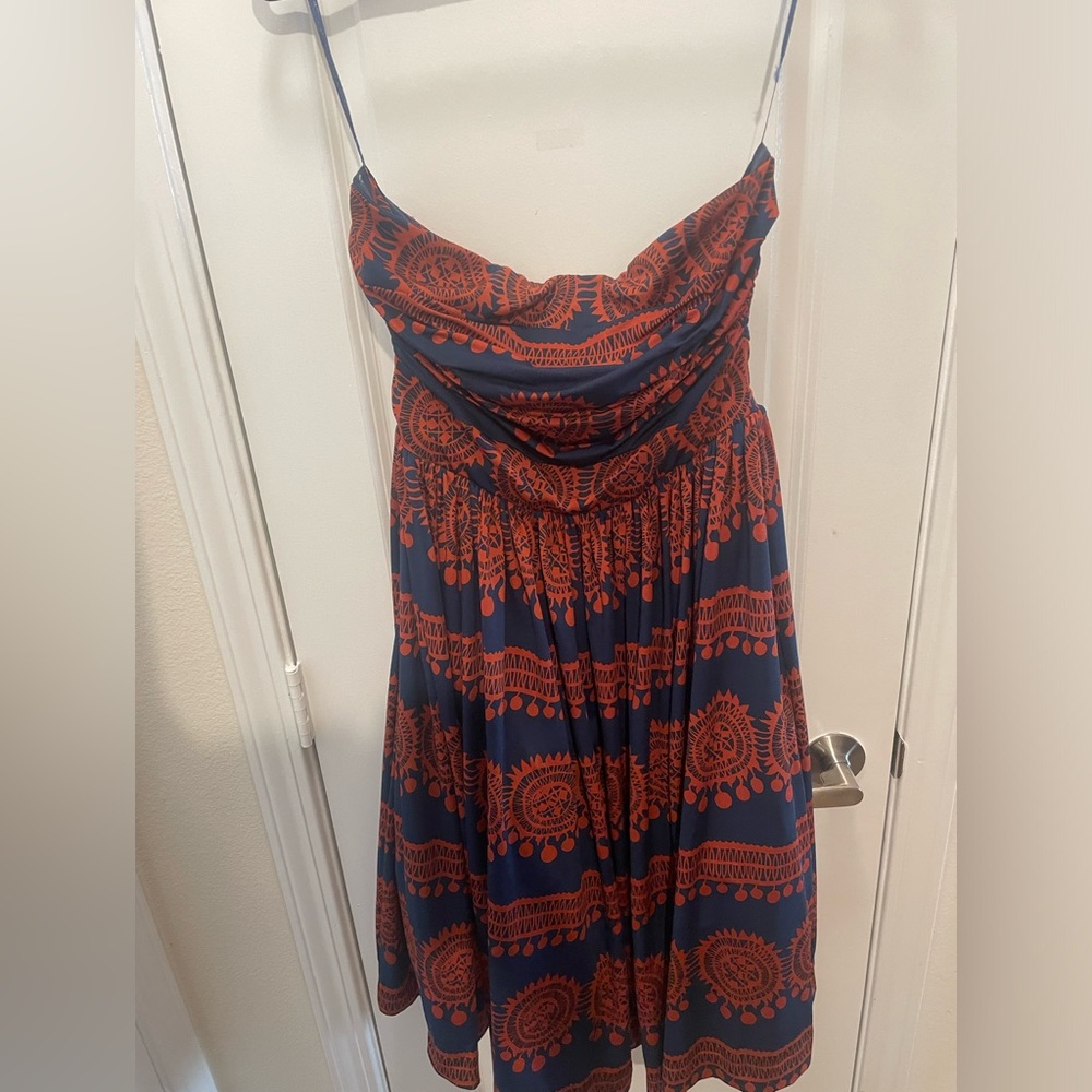 Orange and navy strapless dress.